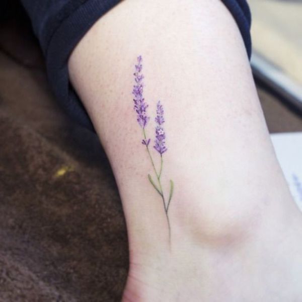Illustrative lavender flower tattoo on the ankle.